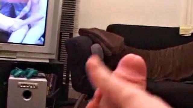 Brian Barrett pulls out his dick and starts stroking. Soon a large anal sex toy approaches from off camera and penetrates Brian's hole. After inserting a second dildo, Brian blows his load.