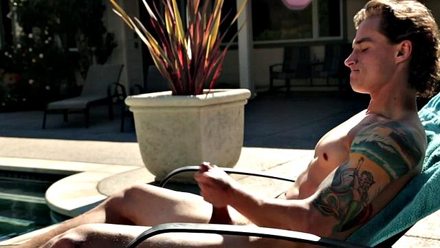 Sixpack jock solo masturbates on sunbed outdoors