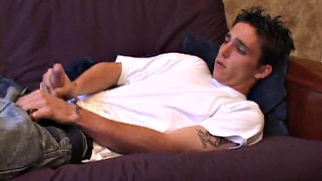 When young Sean Cage unzips his pants, he pulls out his stiff cock and goes to work on it. He gives himself a little head and then inserts sex toys up his ass, before stroking out a warm cum load onto his tummy.