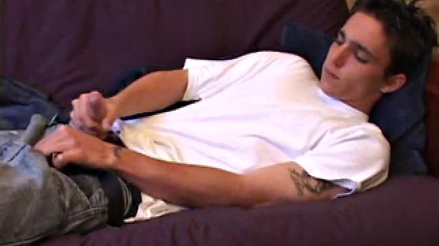 When young Sean Cage unzips his pants, he pulls out his stiff cock and goes to work on it. He gives himself a little head and then inserts sex toys up his ass, before stroking out a warm cum load onto his tummy.