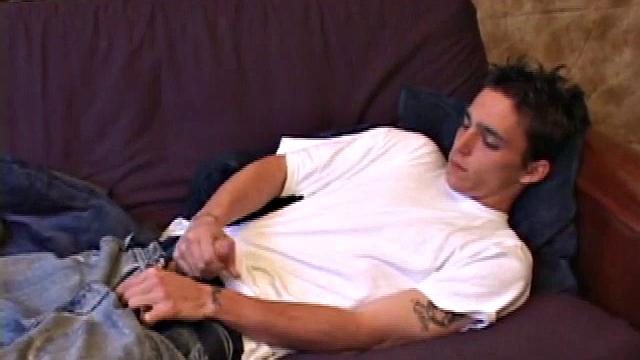 When young Sean Cage unzips his pants, he pulls out his stiff cock and goes to work on it. He gives himself a little head and then inserts sex toys up his ass, before stroking out a warm cum load onto his tummy.