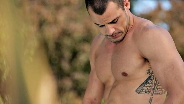 A muscular amateur stroke his cock in a public outdoor pool action