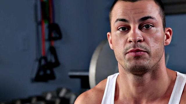 A muscular amateur stroke his cock in a public outdoor pool action