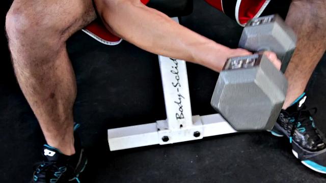 A muscular amateur stroke his cock in a public outdoor pool action