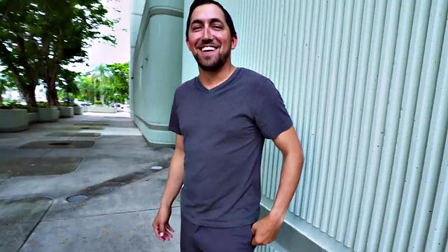 Watch this MILF smile & finger her bald pussy before outdoor sex with a guy in t-shirt and high heels