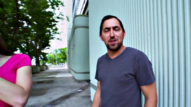 Watch this MILF smile & finger her bald pussy before outdoor sex with a guy in t-shirt and high heels