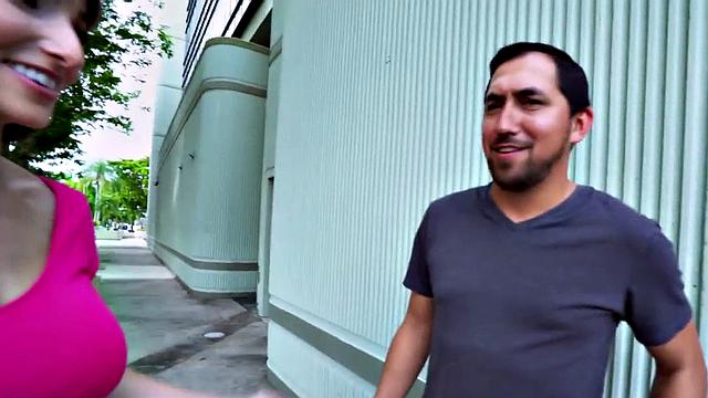 Watch this MILF smile & finger her bald pussy before outdoor sex with a guy in t-shirt and high heels