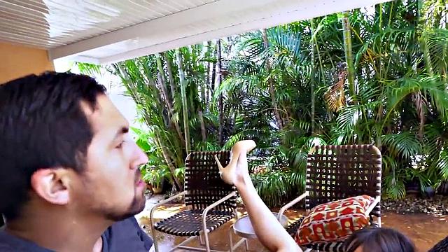 Watch this MILF smile & finger her bald pussy before outdoor sex with a guy in t-shirt and high heels