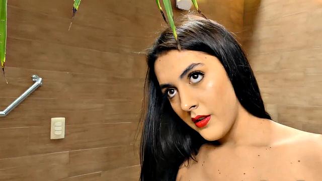 Bombshell Mariana Lins Strokes Her Cock in Front of a Whirlpool