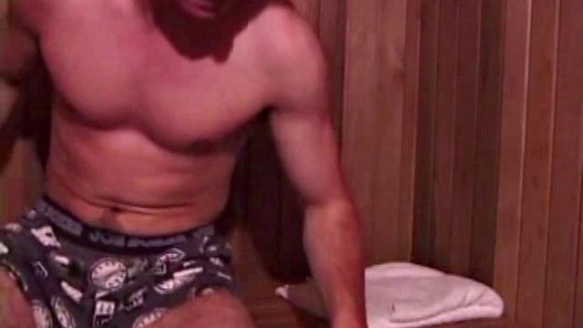 Eddy reclines in the sauna and looks at a porn magazine until a boner pops out of his shorts. Some serious stroking makes him bust a huge nut. Eddy then showers and poses naked for us.