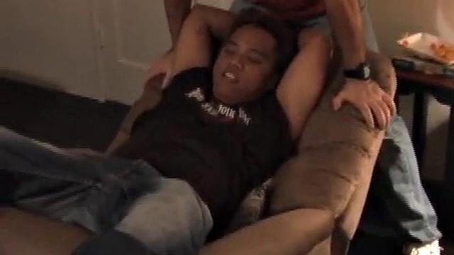 What do two tickle pros and their friend do on a boring Christmas day? They convince their cute Asian buddy to let them tie and tickle him. Azer gets tied to the recliner and tickled mercilessly by Mike and Ricky.