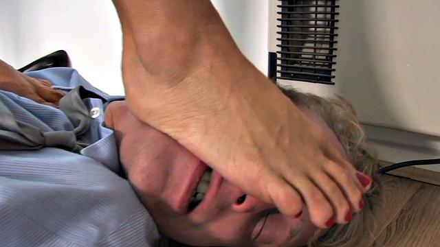 Trampling domina spanks her foot sub in office