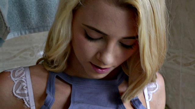 Young, skinny blonde Riley scrubs her tiny body in the shower.