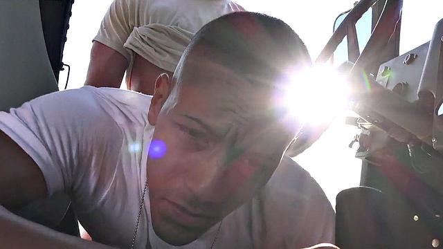 Military stud barebacked outdoors on army truck