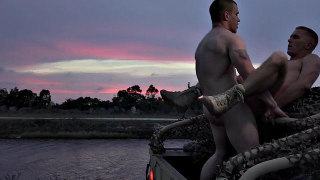 Military stud barebacked outdoors on army truck