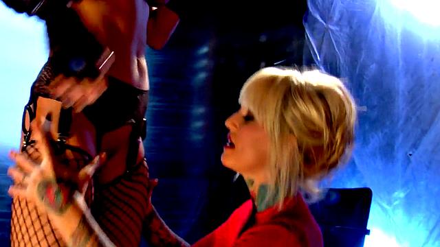 Watch these tattooed lesbians in lingerie finger and lick each other's pussies in fishnets and gloves