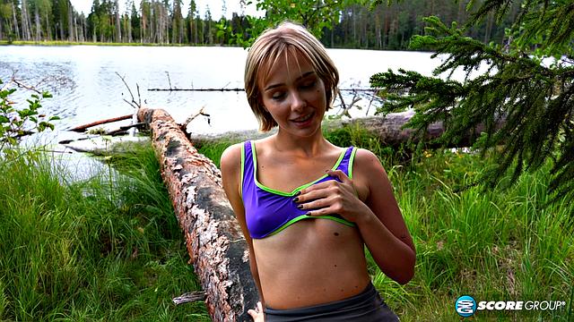 Outdoorsy blonde with perky tits drops her yoga pants and spreads her pussy by a lake.