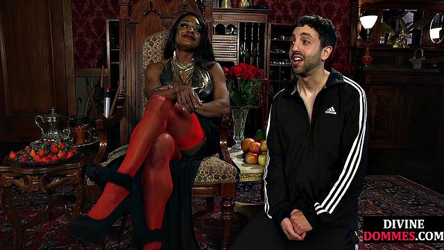 Strict black domme punishing cbt subject with kicking