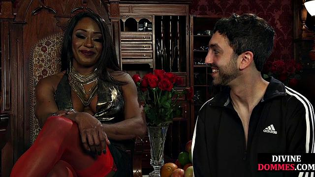 Strict black domme punishing cbt subject with kicking