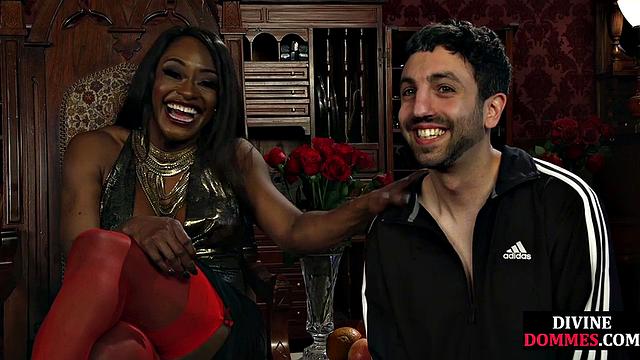 Strict black domme punishing cbt subject with kicking