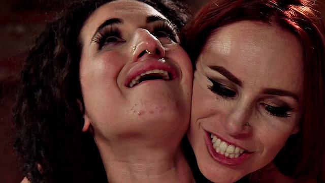 Busty babe gets double penetrated in lesbian bdsm orgy