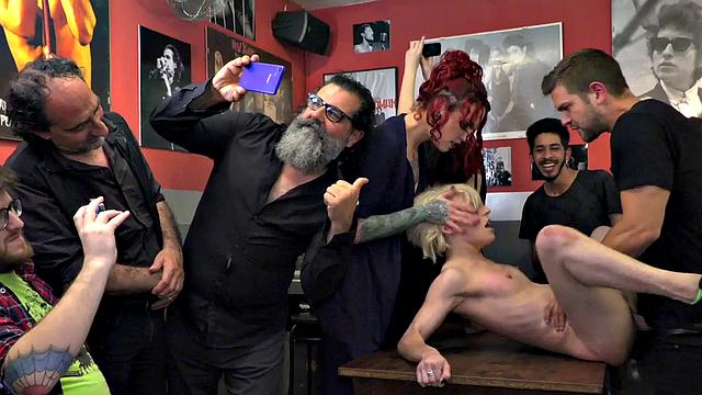 Watch this tattooed slut get humiliated and double penetrated in public by two hung guys