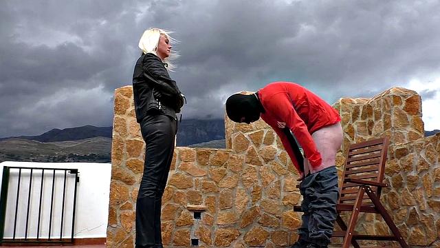 Blonde MILF in leather enjoys ballbusting & CBT in the great outdoors