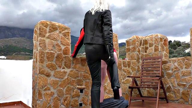 Blonde MILF in leather enjoys ballbusting & CBT in the great outdoors
