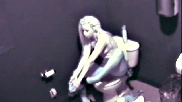 Sexy blonde fingering her pussy on the toilet