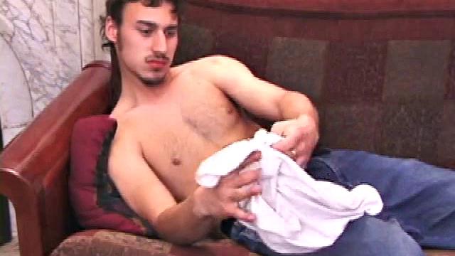 Young Ricky Underton rubs himself in baggy jeans and a t-shirt. Unbuckling and flashing a hairy trail, he pulls off his t-shirt and pushes down his jeans for that big cock head to peek out.