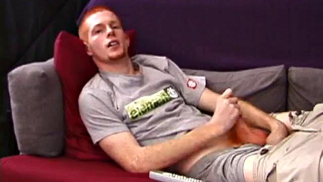 Redheaded Tristian hot to jerk off: cute young guy naked stroking his cock and gyrating on the couch