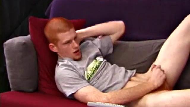 Redheaded Tristian hot to jerk off: cute young guy naked stroking his cock and gyrating on the couch