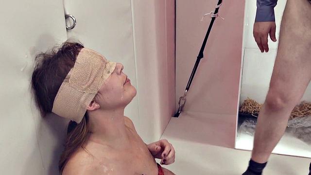 Busty tied up slut gags on toy