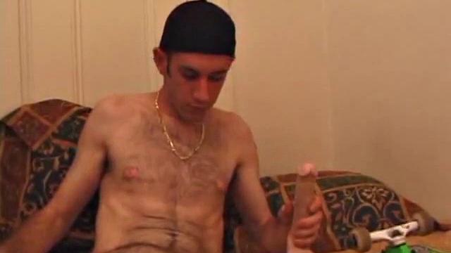 When Tag returns from skateboarding he heads to the bedroom and turns on a video. He begins stripping down and his growing cock flops out. Tag pulls out a couple of sex toys.