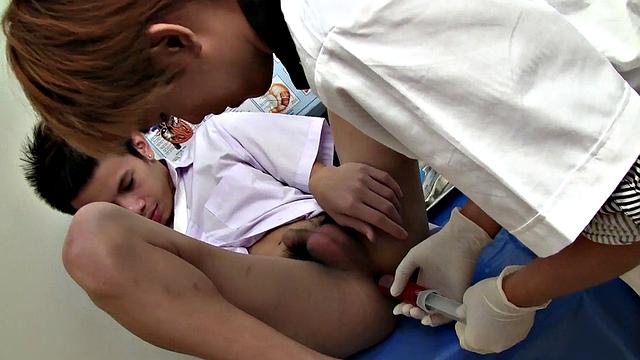 Inked Asian twink sucked off barebacked by doctor