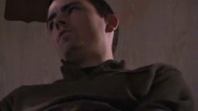 By the time the camera finds him, Dan is already going for his woody. A bit uncomfortable in the chair, he stands up and moves to the staircase, where we can see his hot cock getting harder and harder.