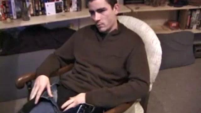 By the time the camera finds him, Dan is already going for his woody. A bit uncomfortable in the chair, he stands up and moves to the staircase, where we can see his hot cock getting harder and harder.