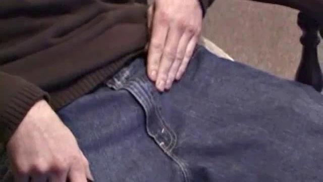 By the time the camera finds him, Dan is already going for his woody. A bit uncomfortable in the chair, he stands up and moves to the staircase, where we can see his hot cock getting harder and harder.