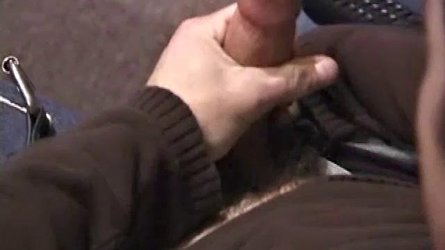 By the time the camera finds him, Dan is already going for his woody. A bit uncomfortable in the chair, he stands up and moves to the staircase, where we can see his hot cock getting harder and harder.