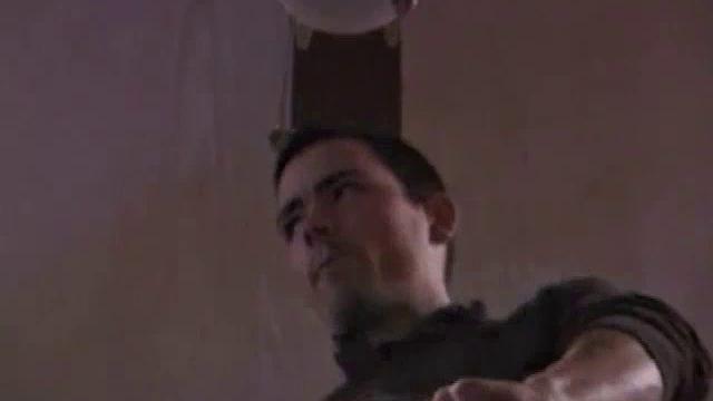 By the time the camera finds him, Dan is already going for his woody. A bit uncomfortable in the chair, he stands up and moves to the staircase, where we can see his hot cock getting harder and harder.