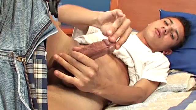 Cute Latin twink Tomas treats us to solo jerk off where he strips naked on the bed and works up his big boner. We get a good look at his asshole as he fingers himself, and then Tomas goes to work stroking that big uncut cock of his.