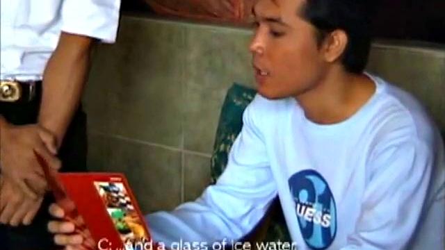 This Asian guy visits a restaurant and the waiter takes his order, fully clothed, but returns wearing an apron. The customer and waiter slip into a more private area to satisfy his hunger.