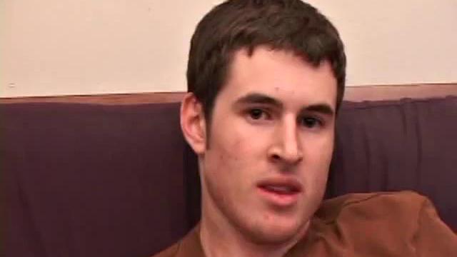 Brian Barrett pulls out his dick and starts stroking. Soon a large anal sex toy approaches from off camera and penetrates Brian's hole. After inserting a second dildo, Brian blows his load.