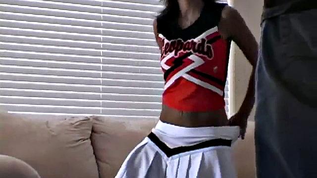 Sexy busty cheerleader Mandy shows off her body