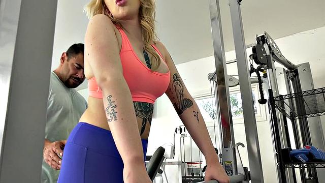 Curly-haired gym babe with tattoos takes it from behind and gets a big surprise