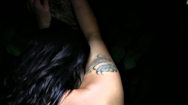 Tattooed brunette gets fucked outdoors and gives a public handjob