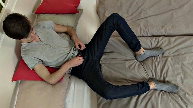 We find twink Bo Randall on a bed playing with his feet. He takes off his socks and enjoys some more foot fetish play. Then starts stroking his cock. With feet in the air, he shows off his hole, and then cums on his feet.