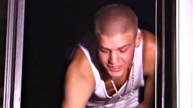 Not content with sitting while he jacks off, Lance teases the neighbors by standing on the roof outside his bedroom window to give everyone a show. Then he finishes by blowing his cum load onto the floor of his bedroom.