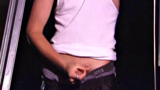 Not content with sitting while he jacks off, Lance teases the neighbors by standing on the roof outside his bedroom window to give everyone a show. Then he finishes by blowing his cum load onto the floor of his bedroom.