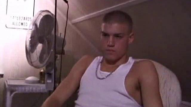 Not content with sitting while he jacks off, Lance teases the neighbors by standing on the roof outside his bedroom window to give everyone a show. Then he finishes by blowing his cum load onto the floor of his bedroom.